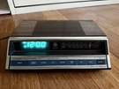 Vintage General Electric 7-4662B Am/fm Alarm Clock Radio Wood Grain Blue. Fixed Price $41.99.
