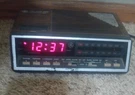 Vintage Model 7-4616A Digital Alarm Clock Am/fm Radio Woodgrain. Fixed Price $15.99.