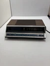 Vintage General Electric 7-4662B Am/fm Alarm Clock Radio Wood Grain. Fixed Price $50.00.