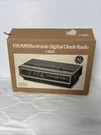 7-4625 Digital Alarm Clock Radio Am/fm General Electric Wood Grain Spacesaver. Fixed Price $94.05.