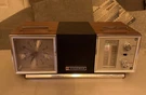 Rare Vtg Panasonic Swivel Alarm Clock Wood Grain Transistor Radio Mid Century. Fixed Price $95.00.