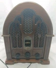 General Electric Reproduction Model No 7-4100JA Cathedral Am/fm Radio Wood. Fixed Price $29.00.
