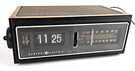 General Electric 7-4303G "flip" Alarm Clock Am/fm Radio Working. Fixed Price $99.00.
