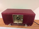 General Electric Cranberry Red 1954 Model 548PH Am Vacuum Tube Radio Clock. Fixed Price $220.00.