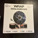 Fuse Wrap Vertical Vinyl Record Player Radio, Bluetooth, Alarm Clock - Bamboo. Fixed Price $110.00.