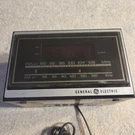 General Electric Am/fm Radio Alarm Clock Mdl 285A1942 Vintage Woodgrain #1055. Fixed Price $15.00.