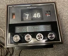 Vintage Magnavox Brush Radio Flip Time Alarm Clock #6113390 Model RE3186WA11. Fixed Price $56.50.