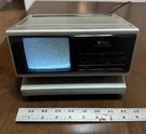 Vintage 1982 Panasonic TR-4060P Bi-sider Folding Tv / Fm-am Radio Clock Unique. Fixed Price $34.00.