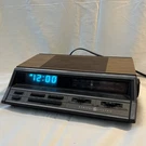 General Electric 7-4666A Alarm Clock Am Fm Radio Wood Grain Works Vintage. Fixed Price $39.99.