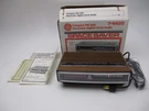 Vintage General Electric 7-4625 Wood Grain Am/fm Alarm Clock Radio Open Box. Fixed Price $49.99.