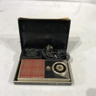 Vintage General Electric Transistor Radio & Charger With Case Model P715. Fixed Price $26.99.