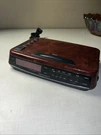 Vintage Faux Wood Grain Optimus CR-319 Am/fm Radio Alarm Clock Red Display Works. Fixed Price $20.00.