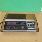 Vintage 7-4870A Am/fm Programmable Clock Radio Walnut Grain Tested Works. Fixed Price $26.25.