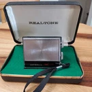 Vintage Realtone Micro Transistor Radio W/ Clam Shell Case Model 1800 Nice. Fixed Price $45.00.