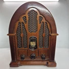 General Electric Reproduction Model No 7-4100JA Cathedral Am/fm Radio Wood. Fixed Price $79.99.
