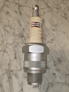 Champion Am/fm Spark Plug Transistor Radio. Fixed Price $125.00.