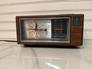 Vintage General Electric 7-4550C Walnut Grain Polystyrene Clock Radio Works. Fixed Price $30.00.