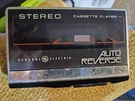 General Electric Stereo Auto Reverse Portable Cassette Player, Black/silver. Fixed Price $20.99.
