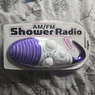 Living Solutions Purple & White Am/fm Shower Radio With Swivel Handle Model: 611. Fixed Price $20.99.