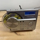 Emerson CKD2328 Am/fm Cd Stereo Clock Radio Swing Door Tested And Working. Fixed Price $100.00.