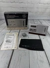 General Electric 7-2100 Portable Clock Am Fm Quartz Lcd Pocket Radio W/stand. Fixed Price $46.71.