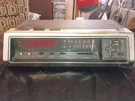 Vintage General Electric 7-4676A Alarm Clock Radio Walnut Grain. Fixed Price $29.99.