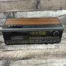 Lxi 667 24288 290 Am/fm Alarm Clock Radio Cassette Stereo Black Woodgrain. Fixed Price $34.99.