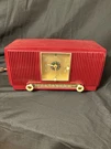 Vintage 1954 General Electric Am Clock Radio Model 548PH Cranberry Red Works. Fixed Price $250.00.