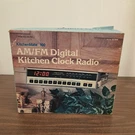 New Realistic Kitchenmate 12-1558 Vintage Under The Cabinet Clock Radio. Fixed Price $175.00.